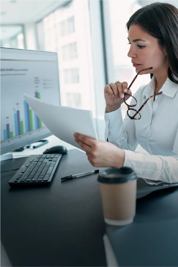 Team reviewing analytics dashboard during a business meeting.