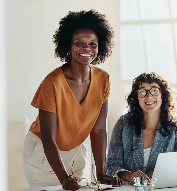 Two women smiling.