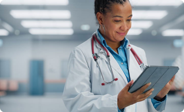 African doctor analyzing pacient profile on a tablet