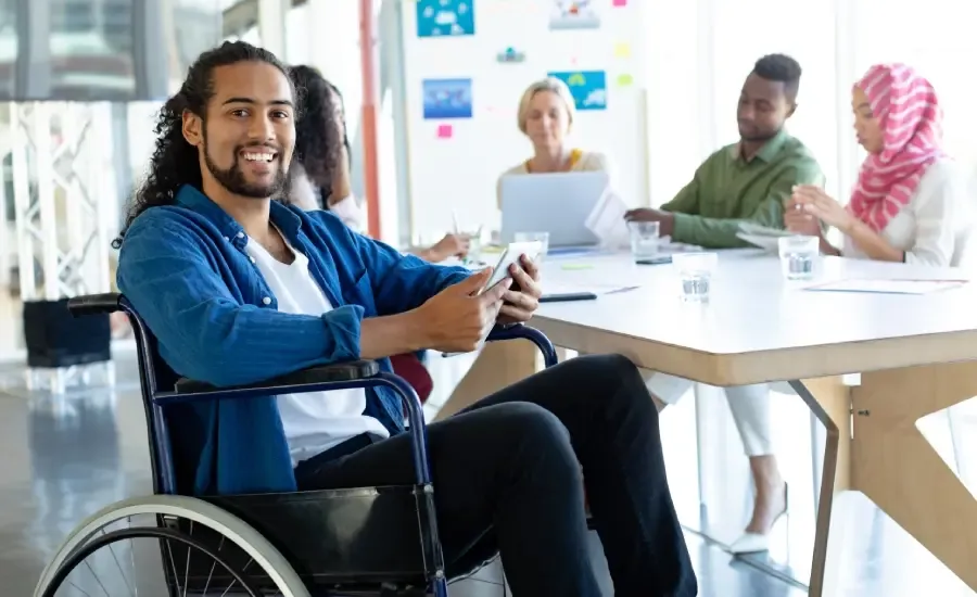 Employee on a wheelchair in a professional work environment.
