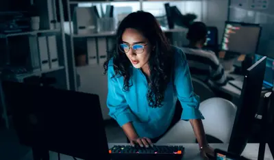 Professional monitoring enterprise AI operations in a technology workspace.