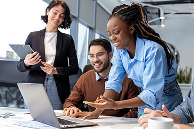 Team working together in front of the computer