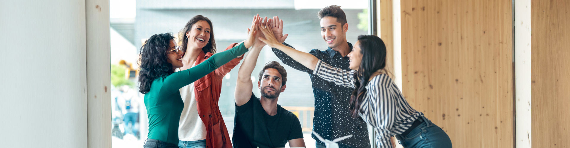 TP team members working together in a modern office environment.